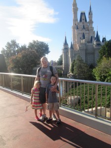 Family pic by our new house.  